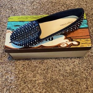 Black studded and spiked flats